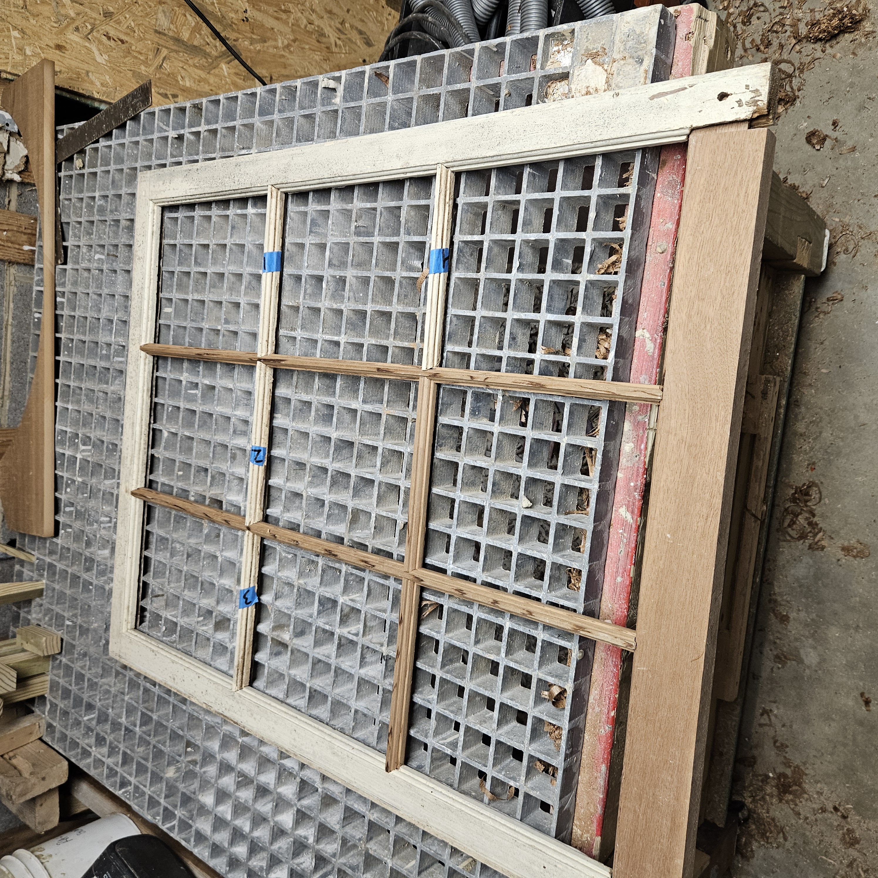 Window sash being rebuilt with new muntins in the shop